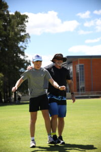 Father and teen child exercising together