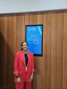 Kemi wrights standing at digital poster