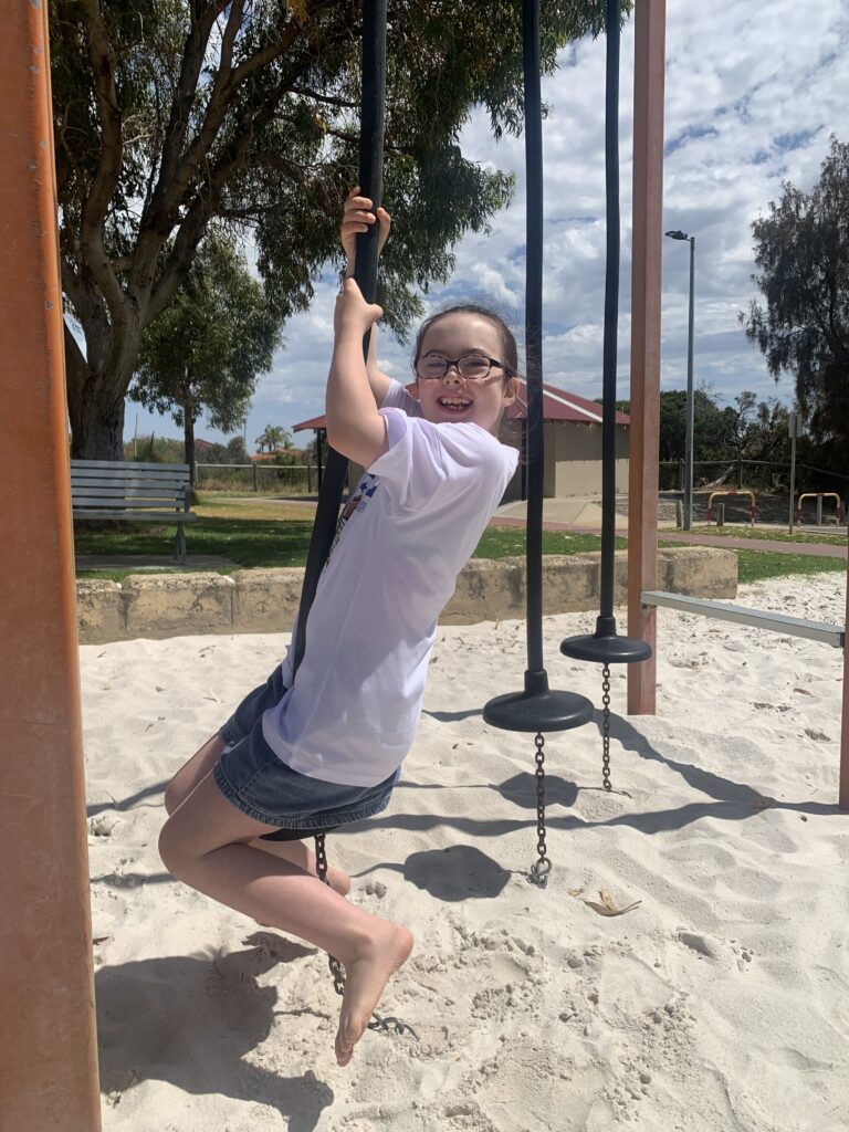 Gianna using outdoor gym equipment