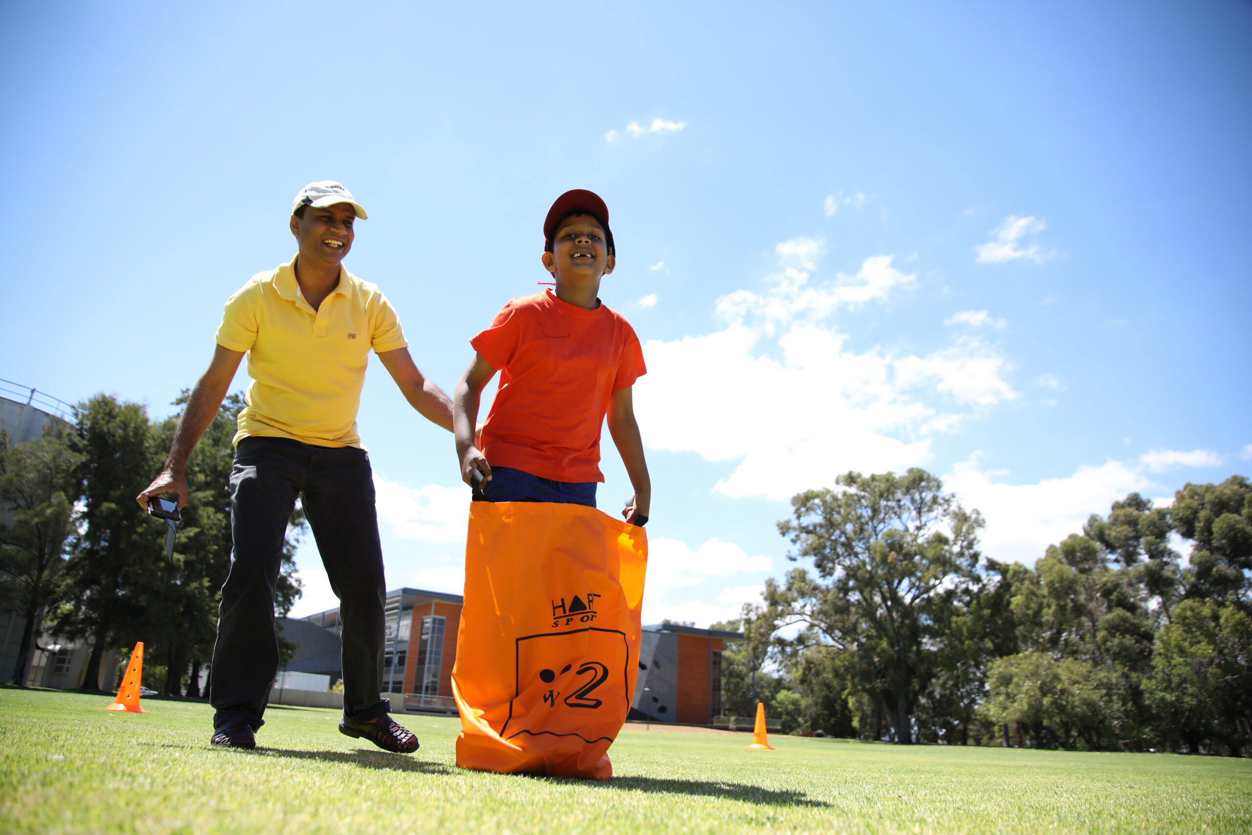 Parent and child having fun playing an active game