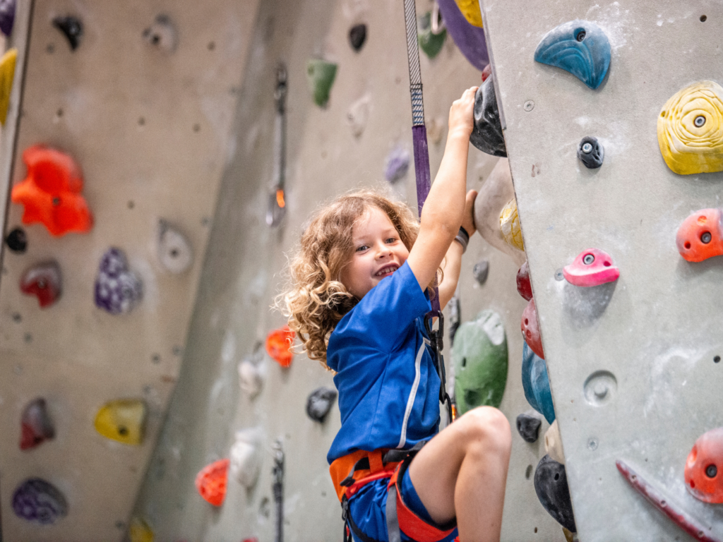 Child happily absorbed in active play they have chosen