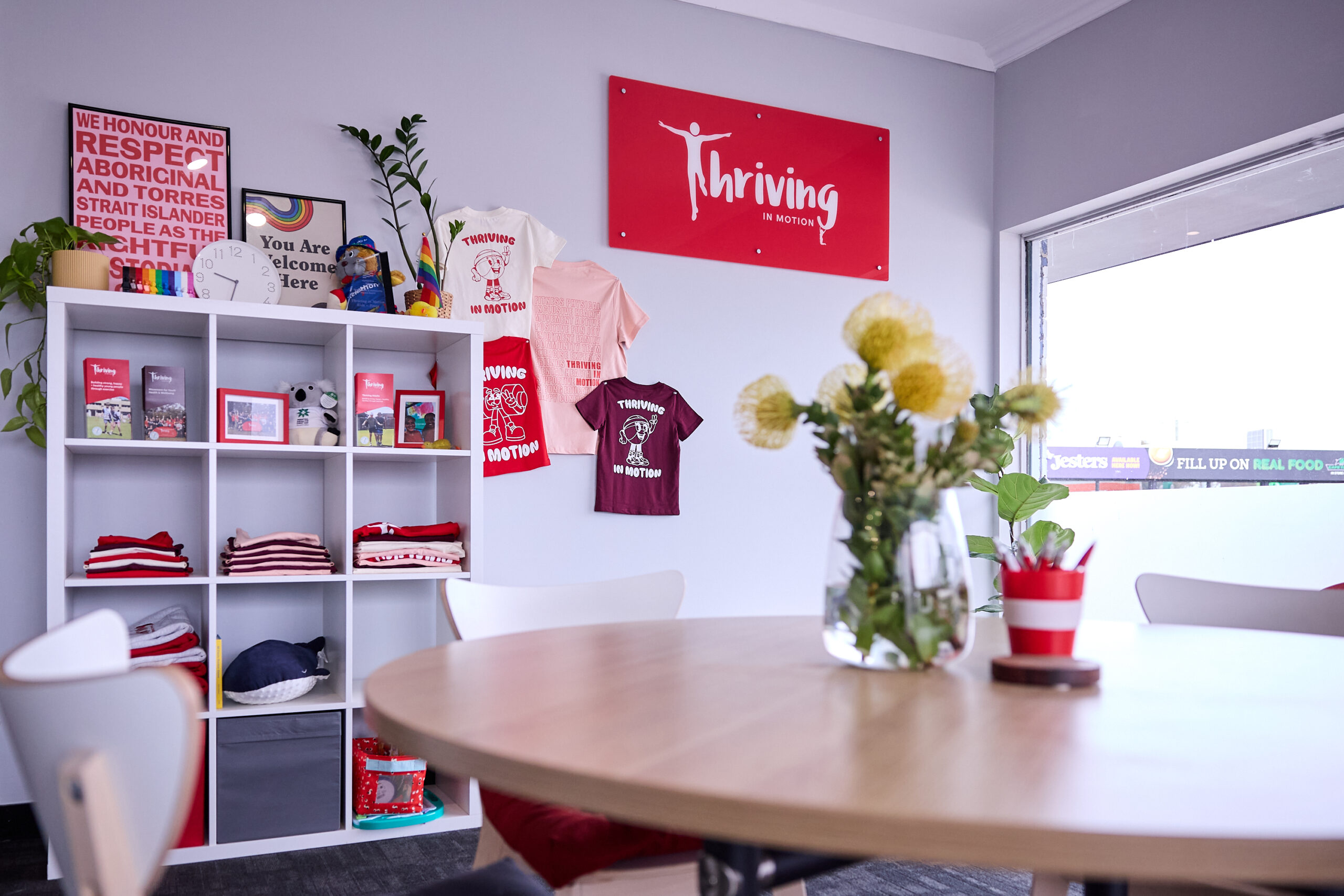 The family waiting area at Thriving HQ, with seating and work spaces
