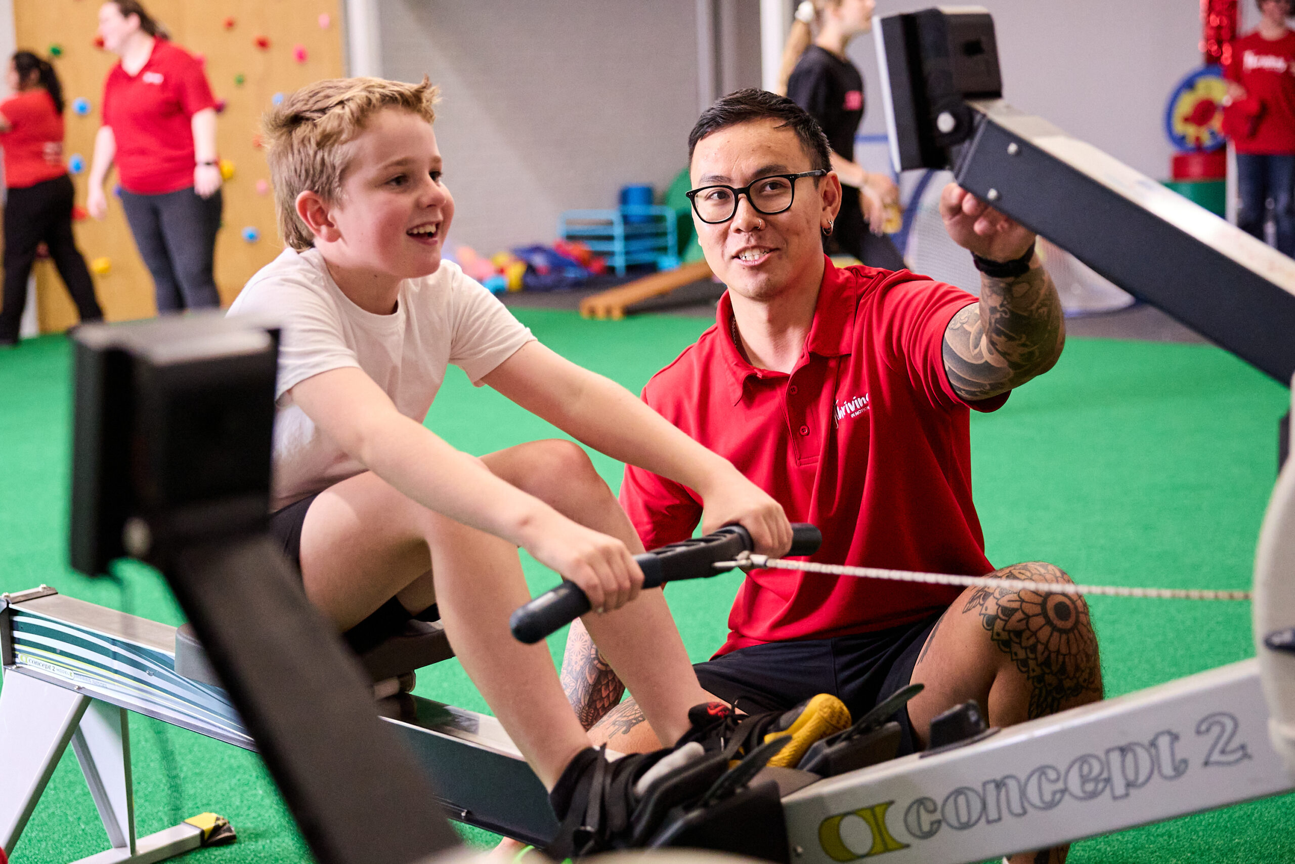 An Accredited Exercise Physiologist working one-on-one with a child in the Balcatta space.
